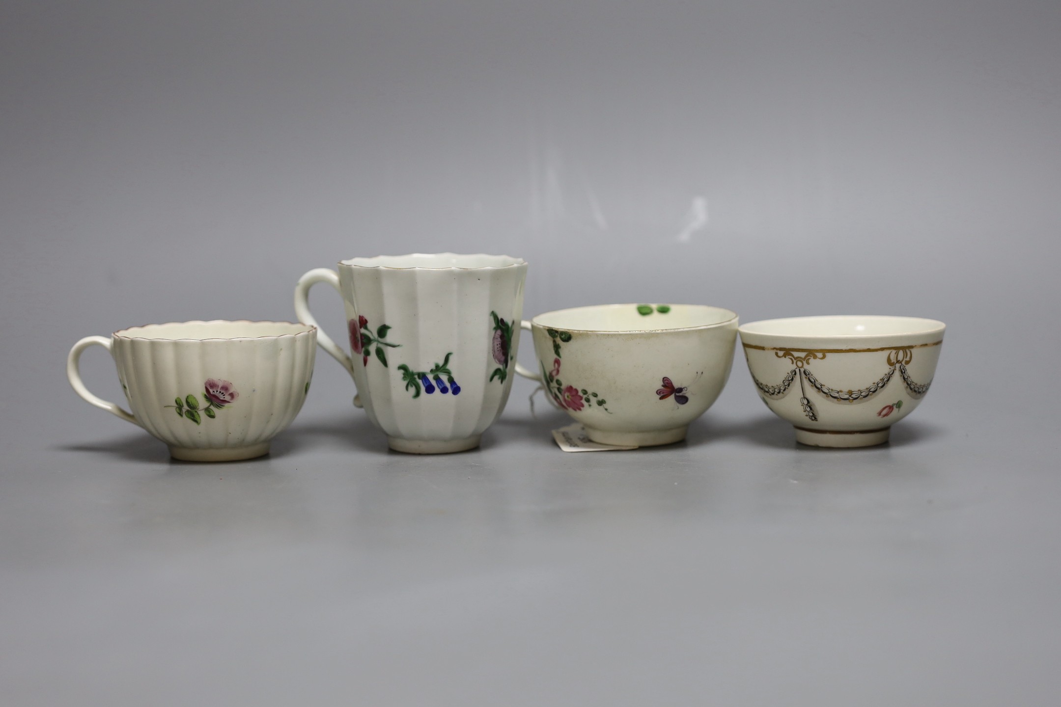 A Worcester tall faceted chocolate cup painted with flowers, a Worcester teacup, purchased Bonhams Zorensky col. part 2 Lot 105, and another Worcester teacup and teabowl